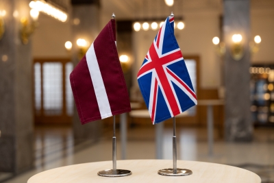 Latvian and UK flags on the table