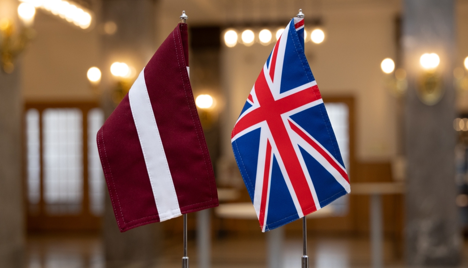 Latvian and UK flags on the table